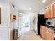 Kitchen with black granite countertops, stainless steel appliances and access to the rest of the home at 2220 Bahia Vista St # G4, Sarasota, FL 34239