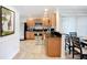 A kitchen with stainless steel appliances, lots of cabinet space, granite countertops and easy access to the dining room at 2220 Bahia Vista St # G4, Sarasota, FL 34239