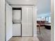Laundry area with stacked washer and dryer and closet space at 2220 Bahia Vista St # G4, Sarasota, FL 34239