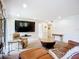Open living space with stone fireplace, neutral walls, and modern decor at 2220 Bahia Vista St # G4, Sarasota, FL 34239