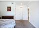 The main bedroom has an ensuite bath, neutral decor, and offers plenty of closet space in the attached room at 2220 Bahia Vista St # G4, Sarasota, FL 34239