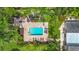 Aerial view of community pool, showcasing the inviting space surrounded by lounge chairs and palm trees at 2220 Bahia Vista St # G4, Sarasota, FL 34239