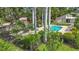 Charming community pool framed by lush tropical landscaping, providing a serene and private oasis at 2220 Bahia Vista St # G4, Sarasota, FL 34239