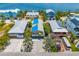 Aerial view of waterfront neighborhood featuring vibrant beach homes with easy access to the waterway at 2513 Avenue B # B, Bradenton Beach, FL 34217