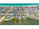 Aerial view of a beachfront community featuring docks and clear blue skies at 2513 Avenue B # B, Bradenton Beach, FL 34217