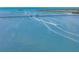 Scenic aerial view of a bridge over water with boats creating wakes on a sunny day at 2513 Avenue B # B, Bradenton Beach, FL 34217