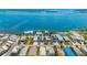 Wide aerial shot of waterfront homes offering breathtaking views of the bay and surrounding waterway at 2513 Avenue B # B, Bradenton Beach, FL 34217