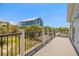 Relaxing balcony space offering views of the neighboring home and verdant tropical landscaping at 2513 Avenue B # B, Bradenton Beach, FL 34217