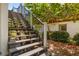 Stairs leading up to the main living area with landscaping at 2513 Avenue B # B, Bradenton Beach, FL 34217