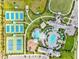 Aerial view of pools, tennis courts, clubhouse and parking lot within a beautiful community at 2565 Star Apple Way, Sarasota, FL 34240