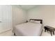 Serene bedroom featuring a bed with soft linens, side tables, and ample natural light at 2565 Star Apple Way, Sarasota, FL 34240