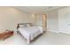 Bedroom with neutral paint, tile floors, and king bed at 2565 Star Apple Way, Sarasota, FL 34240
