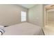 Cozy bedroom with a soft bed and a window, creating a peaceful retreat at 2565 Star Apple Way, Sarasota, FL 34240