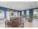 Bright common area featuring a quartz island, stylish lighting, and modern furniture at 2565 Star Apple Way, Sarasota, FL 34240
