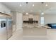 Kitchen features granite countertops, stainless steel appliances, and a breakfast bar at 2565 Star Apple Way, Sarasota, FL 34240