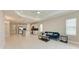 Open floor plan shows living room area with tile floors and contemporary furniture and fixtures at 2565 Star Apple Way, Sarasota, FL 34240