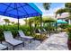 Relaxing outdoor lounge with shaded cabanas, lush greenery, and comfortable seating at 2565 Star Apple Way, Sarasota, FL 34240