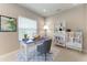 Inviting home office space with a modern desk, chair, and ample storage at 2565 Star Apple Way, Sarasota, FL 34240