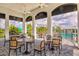 Outdoor patio with tables and chairs overlooking the pool area in this amazing community at 2565 Star Apple Way, Sarasota, FL 34240