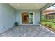 Covered outdoor brick patio that connects to the home, providing seamless indoor-outdoor living at 2565 Star Apple Way, Sarasota, FL 34240