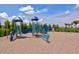 A vibrant playground with slides and swings provides a fun space for children to play at 2565 Star Apple Way, Sarasota, FL 34240