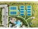 A great aerial view of community tennis courts, playground, and green space at 2565 Star Apple Way, Sarasota, FL 34240