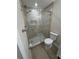Modern bathroom features a tiled glass shower and a toilet at 2636 Hidden Lake N Dr # G, Sarasota, FL 34237