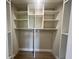 Spacious walk-in closet with custom shelving and a clothing rod at 2636 Hidden Lake N Dr # G, Sarasota, FL 34237