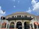 Community clubhouse with unique architectural design and outdoor seating areas at 2636 Hidden Lake N Dr # G, Sarasota, FL 34237