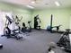 Well-equipped gym with exercise machines, free weights, and ample space for workouts at 2636 Hidden Lake N Dr # G, Sarasota, FL 34237