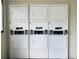 Community laundry room featuring stacked dryers, providing convenient and efficient laundry solutions at 2636 Hidden Lake N Dr # G, Sarasota, FL 34237