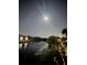 Moonlit view of a pond at night at 2636 Hidden Lake N Dr # G, Sarasota, FL 34237