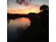 Sunset view of the pond at 2636 Hidden Lake N Dr # G, Sarasota, FL 34237