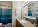 Bathroom with a granite countertop vanity and shower with a curtain at 2904 64Th W St # 2904, Bradenton, FL 34209