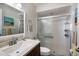 Bathroom featuring a vanity with a quartz countertop and tiled shower at 2904 64Th W St # 2904, Bradenton, FL 34209