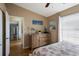 Bedroom featuring a dresser with beach-themed decor, adjacent to the kitchen at 2904 64Th W St # 2904, Bradenton, FL 34209