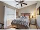 Bedroom with colorful bedding, ceiling fan and great natural light at 2904 64Th W St # 2904, Bradenton, FL 34209