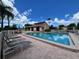 Beautiful pool with plenty of lounge chairs and tables for entertaining on a sunny day at 2904 64Th W St # 2904, Bradenton, FL 34209