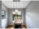 Dining area with modern lighting fixture, adjacent to the window at 2904 64Th W St # 2904, Bradenton, FL 34209