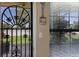 This front door has decorative bars and a screen that looks out onto a green space at 2904 64Th W St # 2904, Bradenton, FL 34209