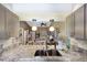 Open concept kitchen with granite counters and stainless steel sink overlooking the bright living area at 2904 64Th W St # 2904, Bradenton, FL 34209