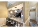 Open kitchen with granite countertops, stainless steel appliances, and seating at the bar at 2904 64Th W St # 2904, Bradenton, FL 34209