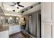 Modern kitchen featuring stainless steel appliances, granite countertops, and open layout to living space at 2904 64Th W St # 2904, Bradenton, FL 34209