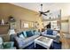 Bright living room featuring vaulted ceiling, modern decor, and seamless flow to kitchen at 2904 64Th W St # 2904, Bradenton, FL 34209