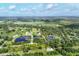 Expansive aerial view of the property featuring lush greenery, ponds, and the property line at 3045 Logue Rd, Myakka City, FL 34251