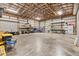 Well-organized garage featuring high ceilings, metal framing, roll-up doors, and plenty of storage space at 3045 Logue Rd, Myakka City, FL 34251