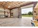 Large garage with high ceilings, metal framing, and multiple roll-up doors offering easy access at 3045 Logue Rd, Myakka City, FL 34251