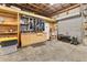 Garage interior with organized storage solutions, including shelving and cabinets at 3045 Logue Rd, Myakka City, FL 34251