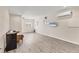 Large finished interior with light grey vinyl flooring, mini split and bright walls at 3045 Logue Rd, Myakka City, FL 34251