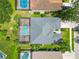 Aerial view of the property showing a backyard pool with screen enclosure and a well-maintained roof at 315 36Th Ne St, Bradenton, FL 34208